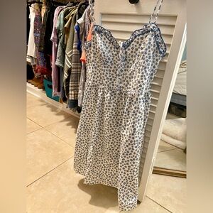 White dress with blue flowers all over